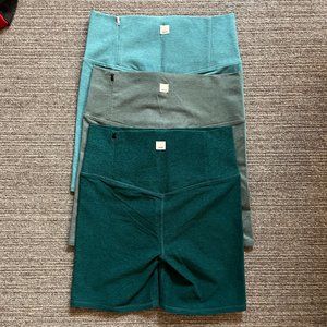 Three Pairs of VUORI's Clean Elevation Shorty Bike Shorts in shades of Green M